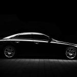 Silhouette of black sports car on black background