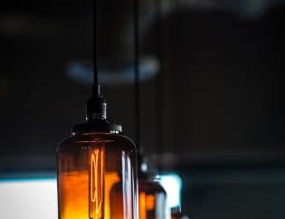 Row of light fixtures hanging from a ceiling