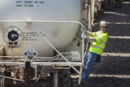 ERCO employee disembarking from back of train.